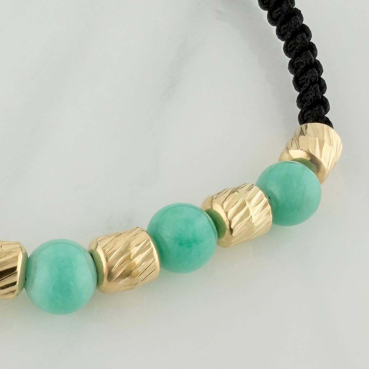 Pulsera Tejida Negra Morralla Esmeralda 5Uni Oro Amarillo 18K