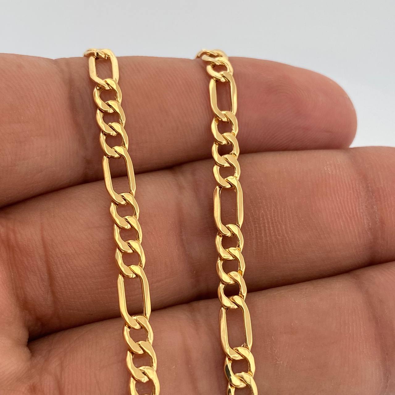 Cadena Figaro 9.15gr / 23 3/4 in / 4.4mm Oro Amarillo +1 18K %