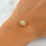 Charm Skull In Hoop 1.05gr / 1cm / White Zircons. Black And Blue 18K Yellow Gold ©