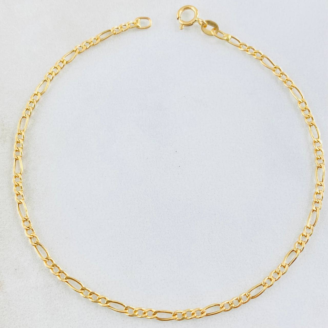 Pulso Figaro 0.7gr / 7 1/2 in / Oro Amarillo +1 18K