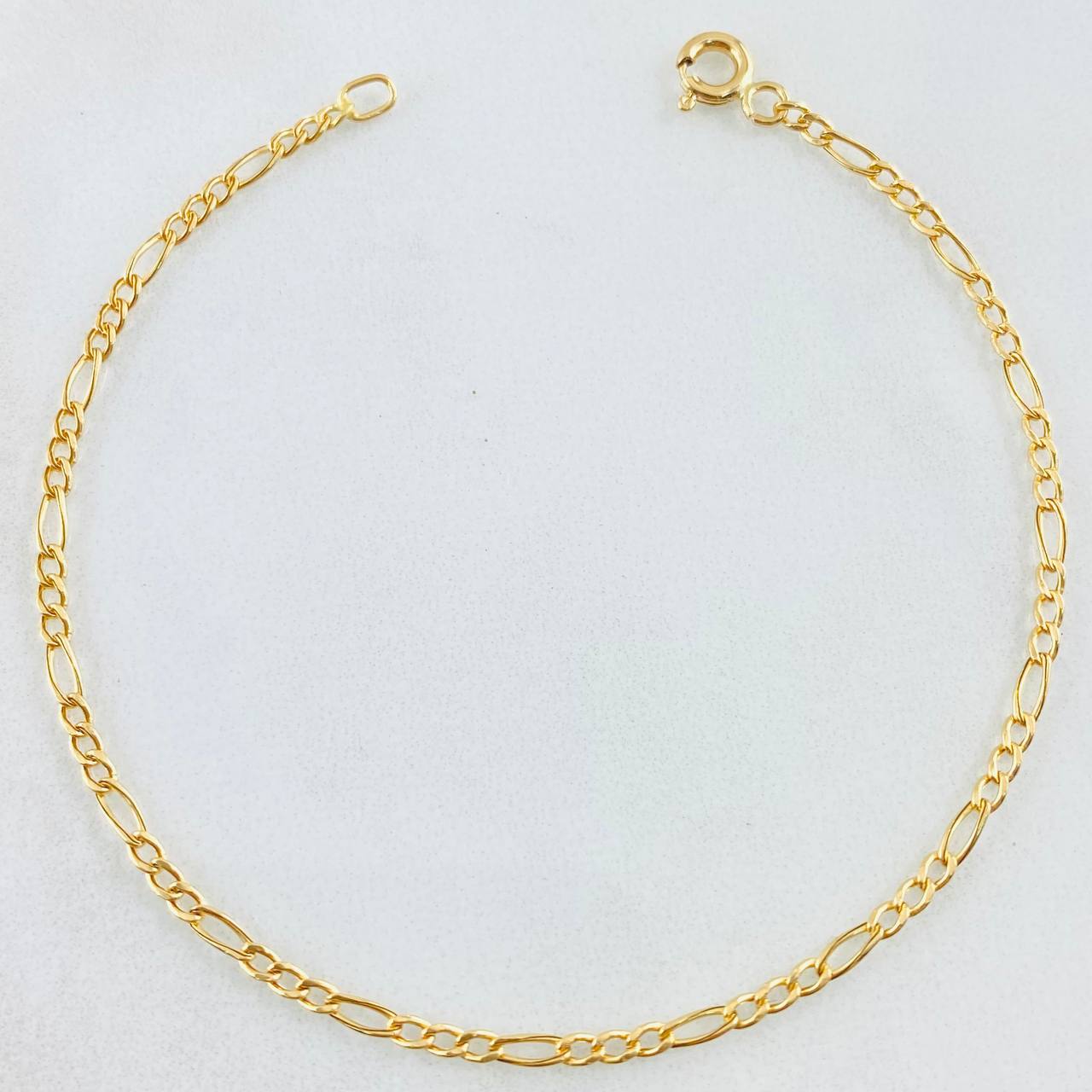 Figaro Bracelet 0.65gr / 6 3/4 in / 18K Gold +1