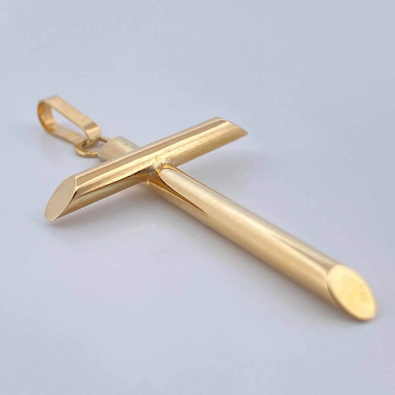 Dije Cruz 1.8gr / 1 1/2 in / Oro Amarillo 18K $