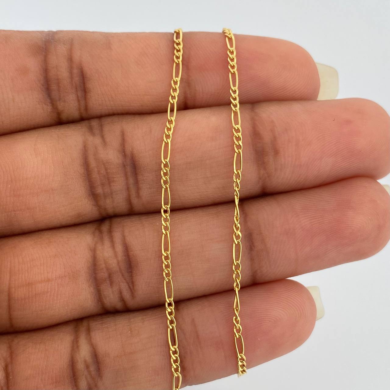 Cadena Figaro 1.4gr / 19 3/4 in / 1.35mm Oro Amarillo +1 18K $