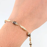 Pulso Rustico Dubai Barril Cauchos Negros 4.1gr / 7 3/4 in / 5mm Oro Amarillo 18K ©