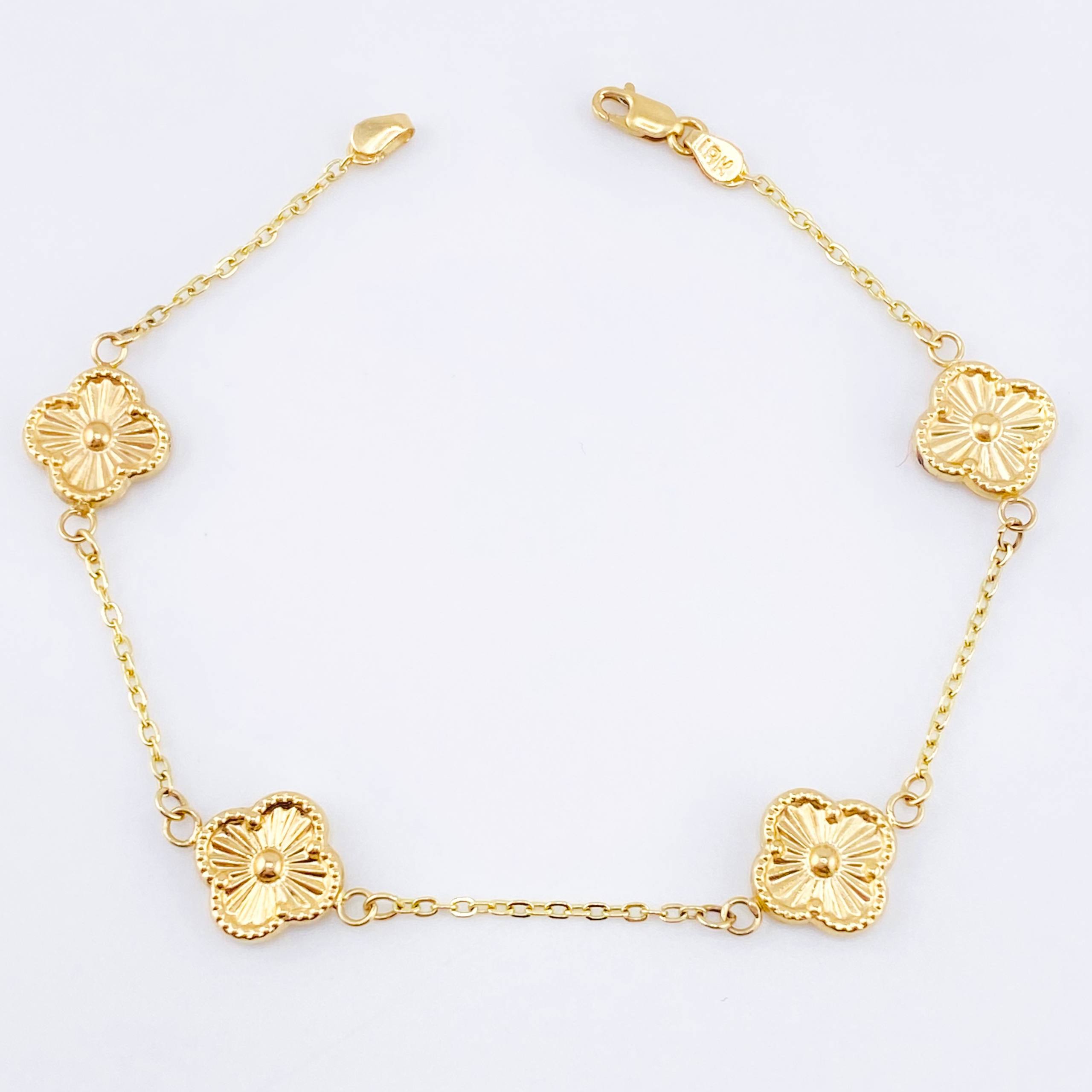 Pulso Aro seguido Treboles Flores Diamantadas 2.85gr / 7 1/4 in / 10mm Oro Amarillo Nac.Esp. 18K