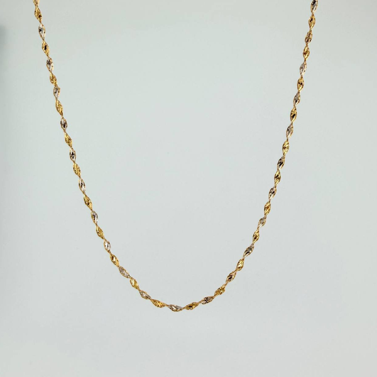 Cadena Singapur 2.85gr / 24 in / 1.25mm Dos Oros Amarillo Blanco +3 18K %