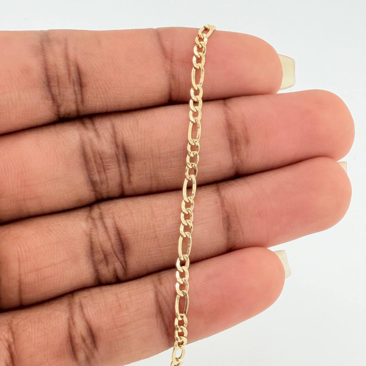 Pulso Figaro 1.4gr / 7 1/2 in / 2.2mm Oro Amarillo +1 18K $