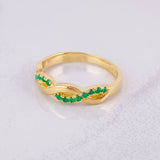 Intertwined Ring Emeralds 25pts 3.05g / T5 3/4 Yellow Gold 18K