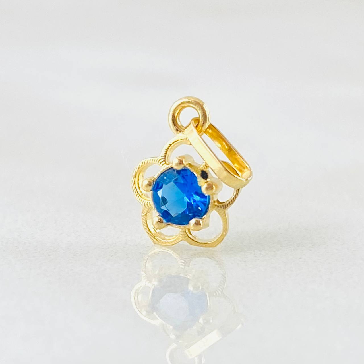 Dije Flor 0.4gr / 1/2 in / Oro Amarillo 18K