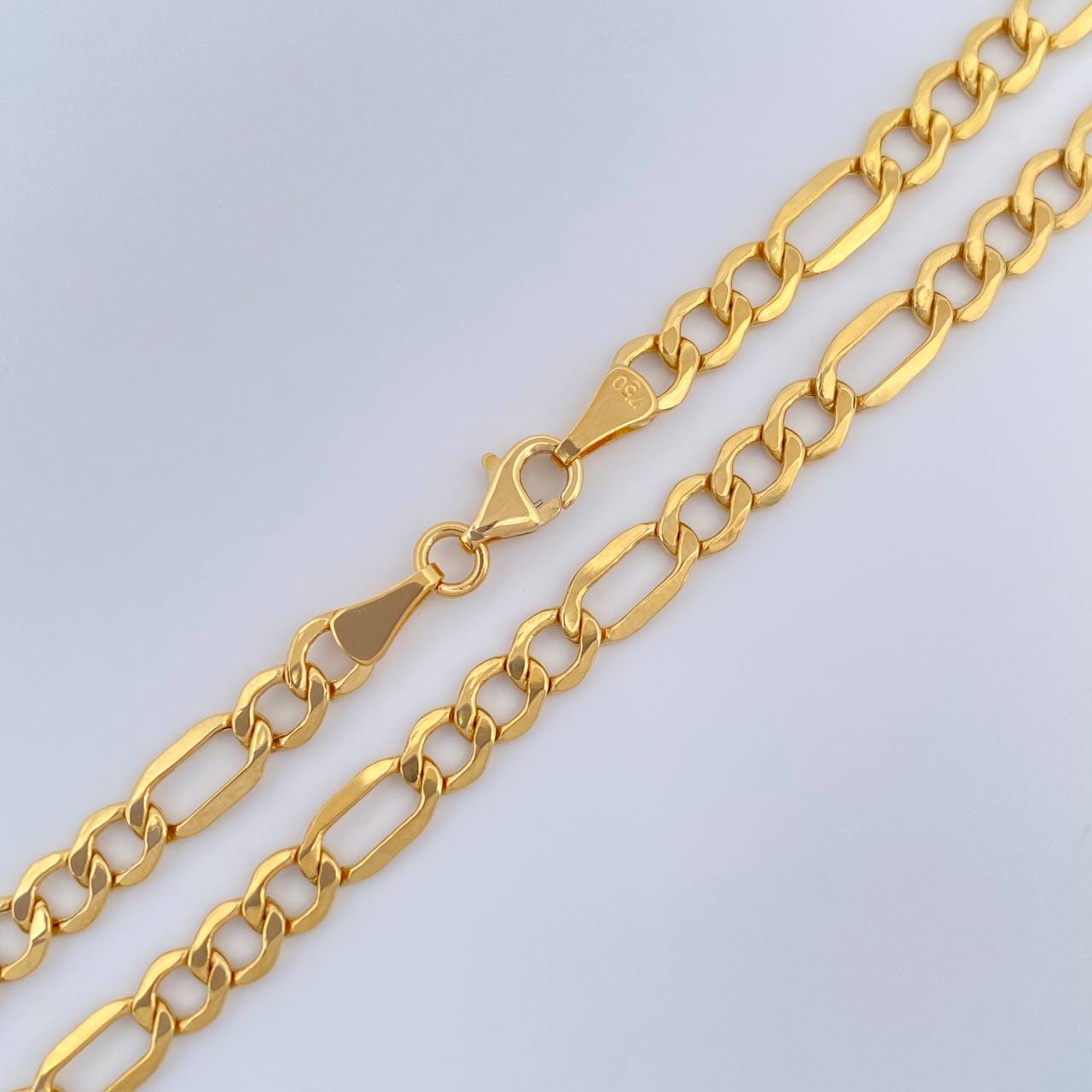 Cadena Figaro 8.6gr / 23 1/2 in / 4.39mm Oro Amarillo +1 18K $