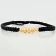 Pulsera Tejida Negra Bolas Diamantadas Oro Amarillo 18K