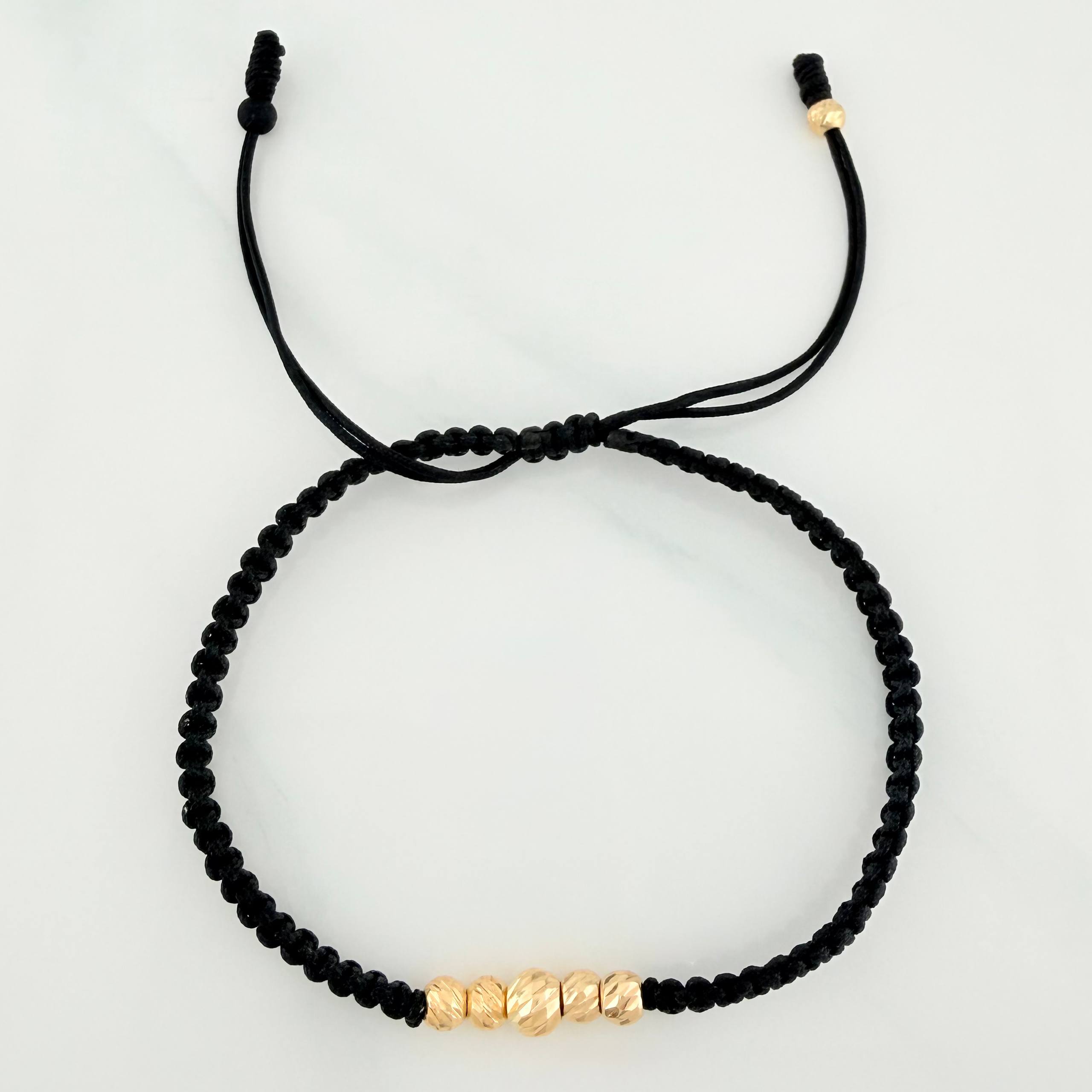 Pulsera Tejida Negra Bolas Diamantadas Oro Amarillo 18K
