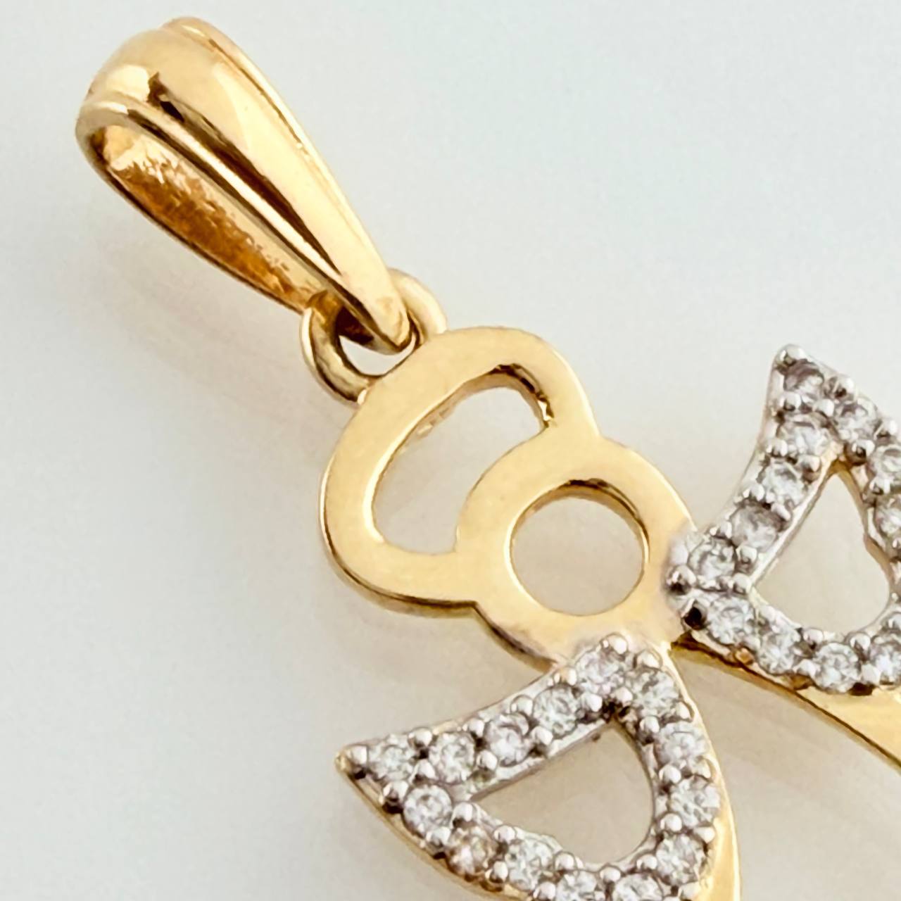 Dije Angel 1.65gr / 1 in / Dos Oros Amarillo Blanco 18K %