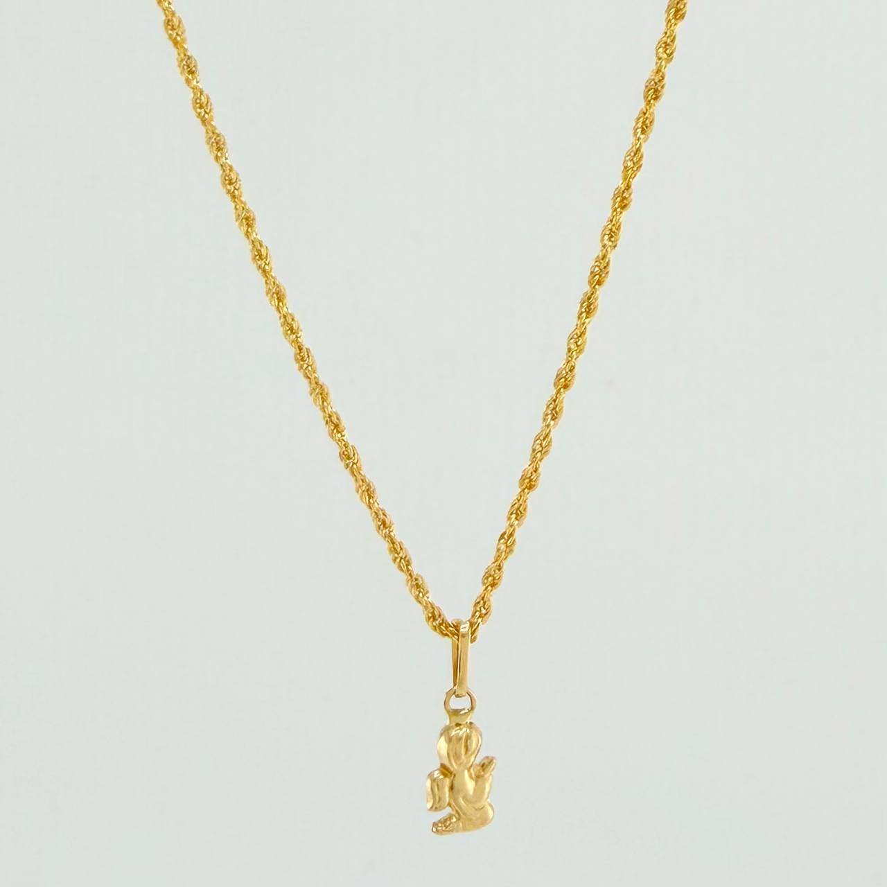 Set Cadena y Dije Lazo + Angel De La Guarda 1.6gr / 23 1/2 in / 1.15mm Oro Amarillo 18K $