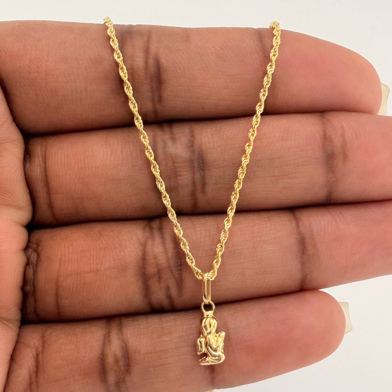 Set Cadena y Dije Lazo + Angel De La Guarda 1.3gr / 20 1/4 in / 1.15mm Oro Amarillo 18K $