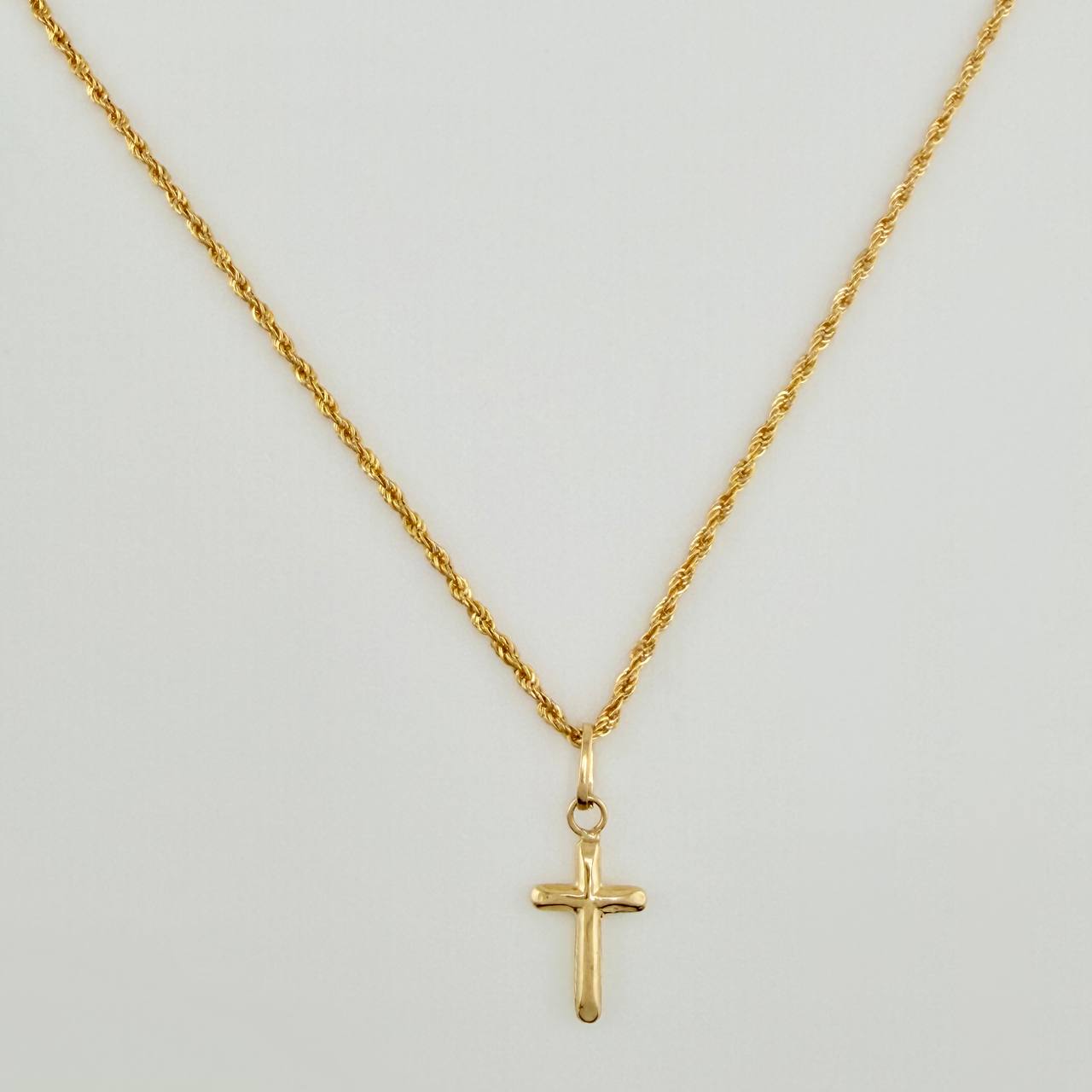 Set Cadena y Dije Lazo + Cruz 1.25gr / 19 3/4 in / 1.08mm Oro Amarillo 18K $