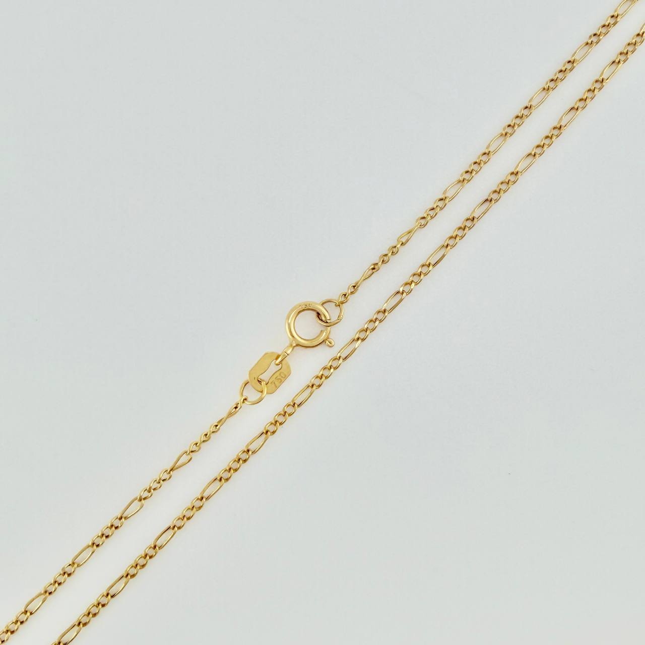 Set Cadena y Dije Figaro + Cruz 1.4gr / 19 3/4 in / 1.25mm Oro Amarillo 18K $