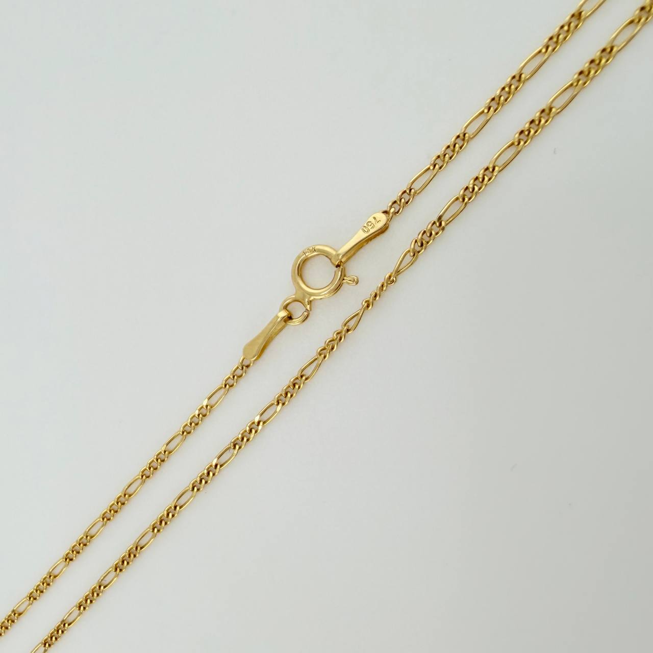 Set Cadena y Dije Figaro + San Benito 1.85gr / 19 3/4 in / 1.27mm Oro Amarillo 18K $