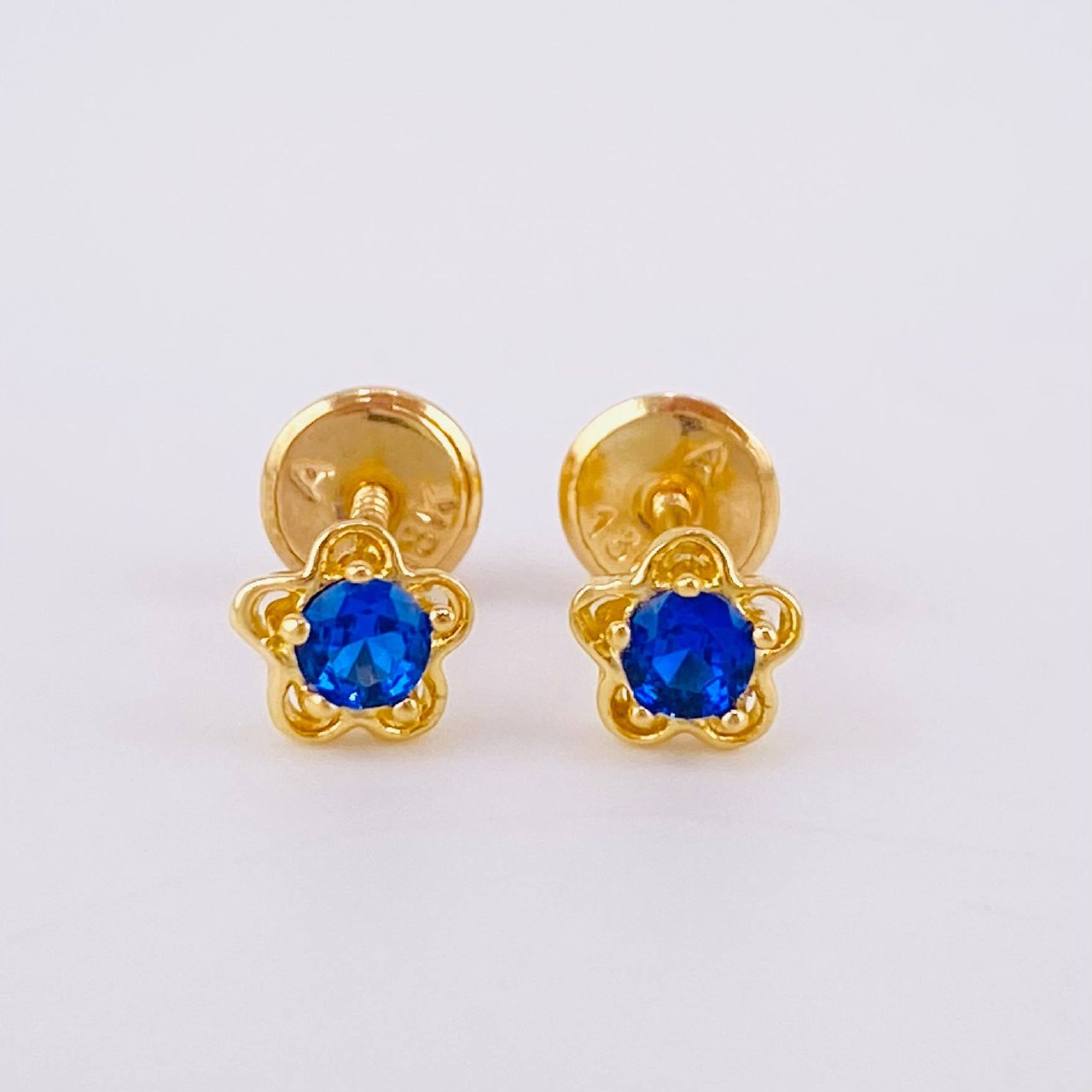 Topos Flor 0.9gr / Oro 18K ©