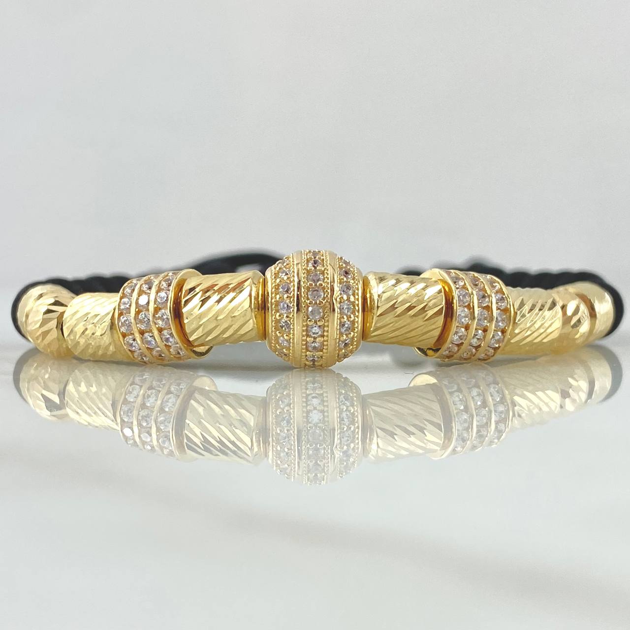 Pulsera Negra Herraje Rueda Abultada Circones Blancos  7.1gr / 6mm Bolas Diamantadas 2 und Cilindros 6und Oro Amarillo 18K ©