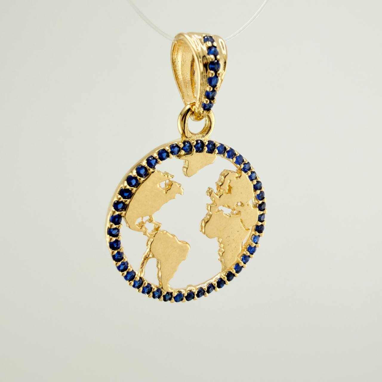 Dije Silueta Tierra 2gr / 1 in / Oro Amarillo 18K &