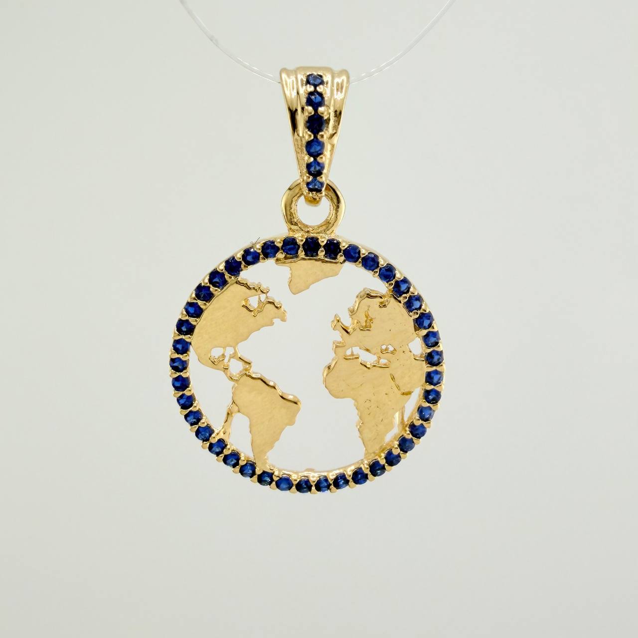 Dije Silueta Tierra 2gr / 1 in / Oro Amarillo 18K &