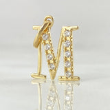 Dije Letra M Silueta 1.1gr / 1.8cm / Oro 18K ©