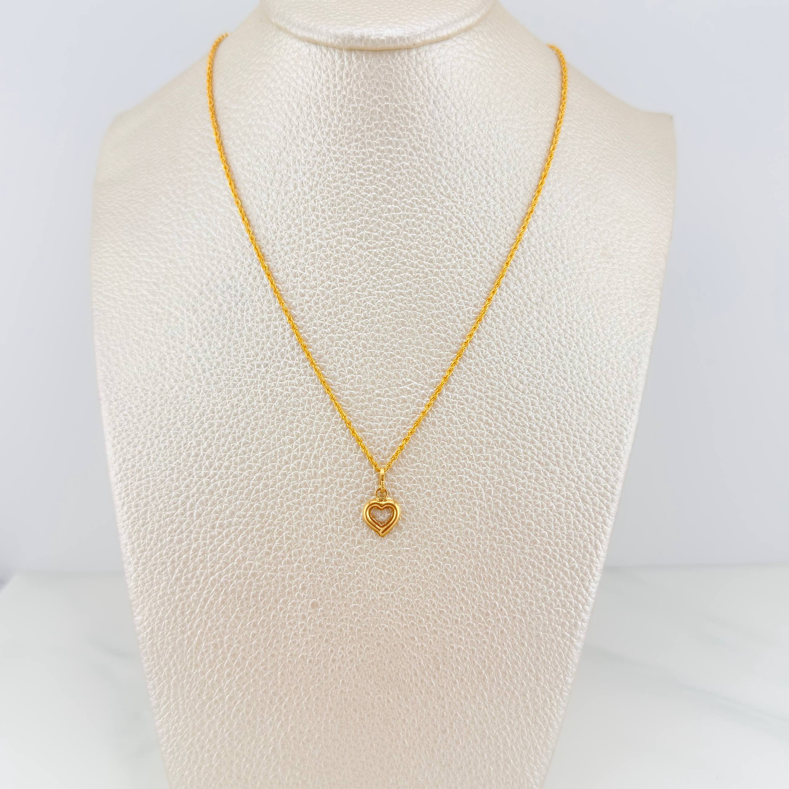 Set Cadena Lazo + Dije Silueta Corazon / 1,4 gr / 20 in Oro Amarillo 18K