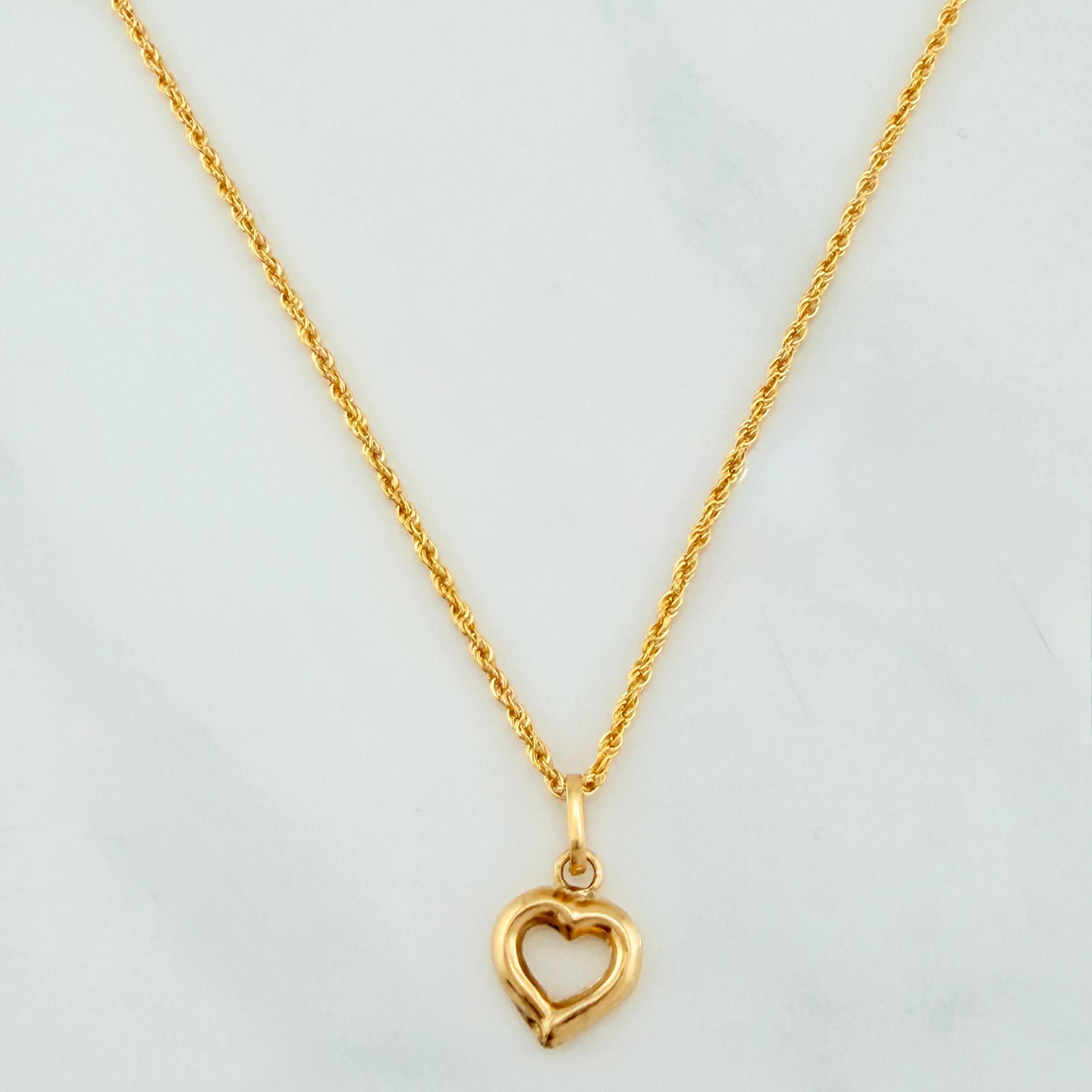 Set Cadena Lazo + Dije Silueta Corazon / 1,4 gr / 20 in Oro Amarillo 18K