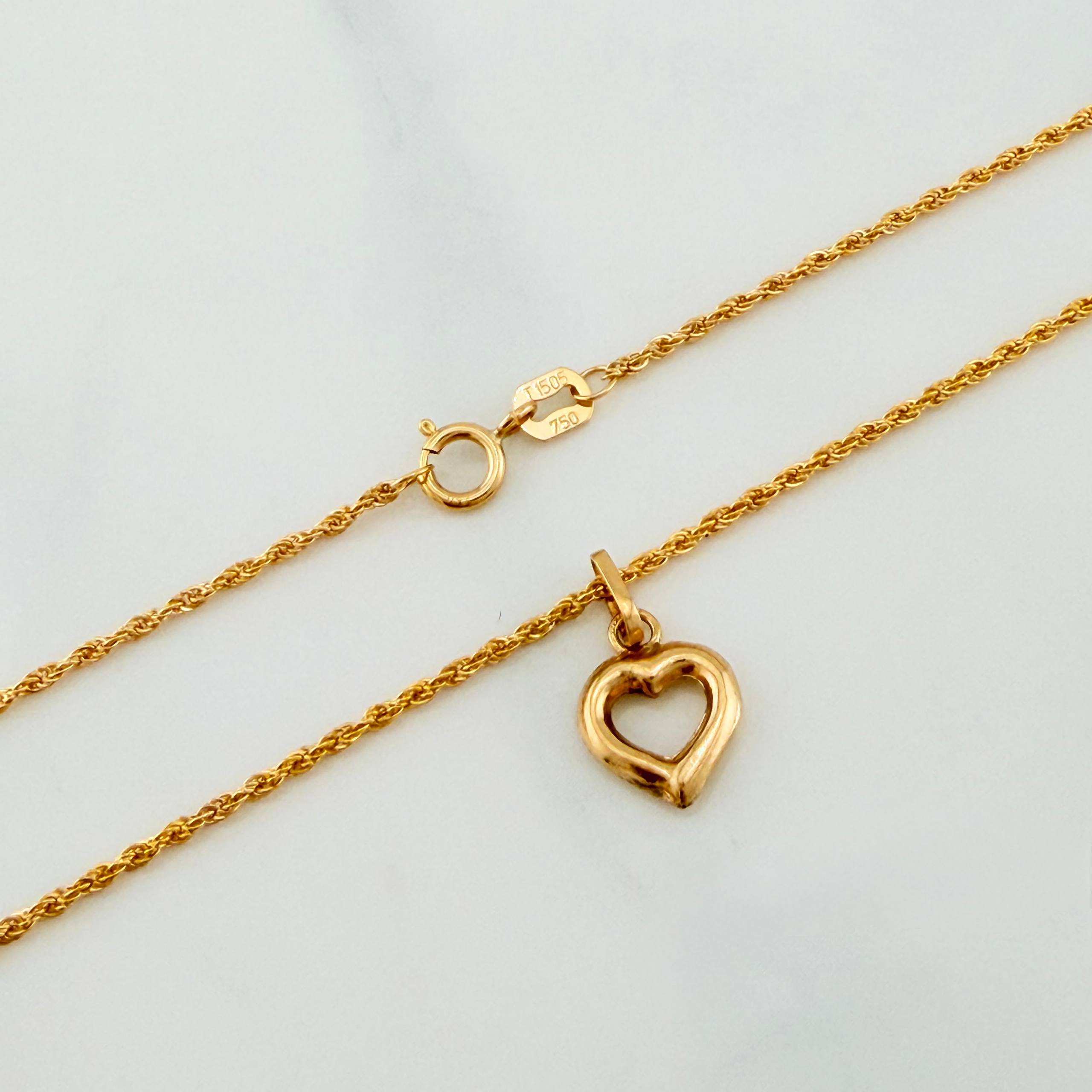 Set Cadena Lazo + Dije Silueta Corazon / 1,4 gr / 20 in Oro Amarillo 18K