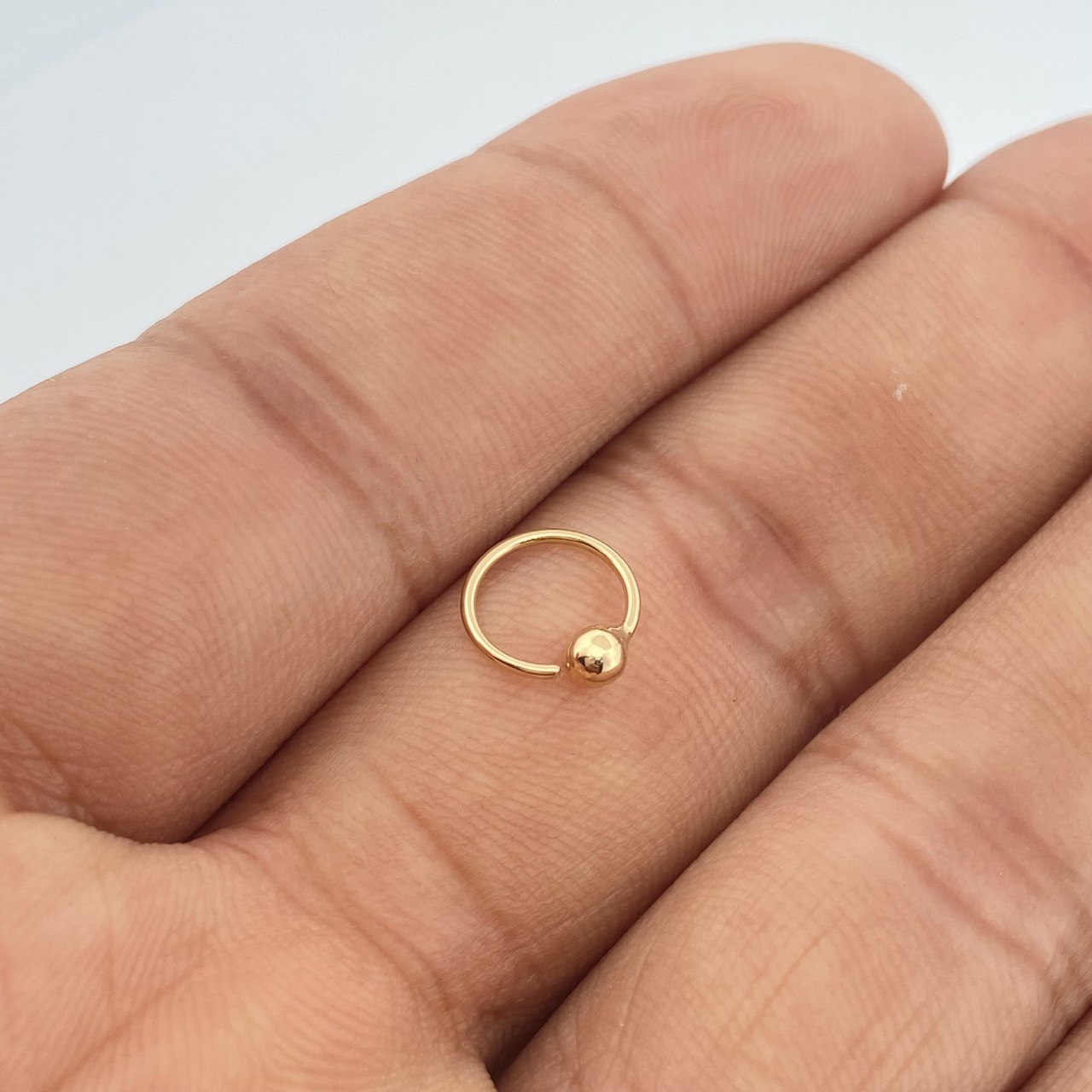 Piercing Aro Bola 0.25gr / 1/2 in / Oro Amarillo 18K $