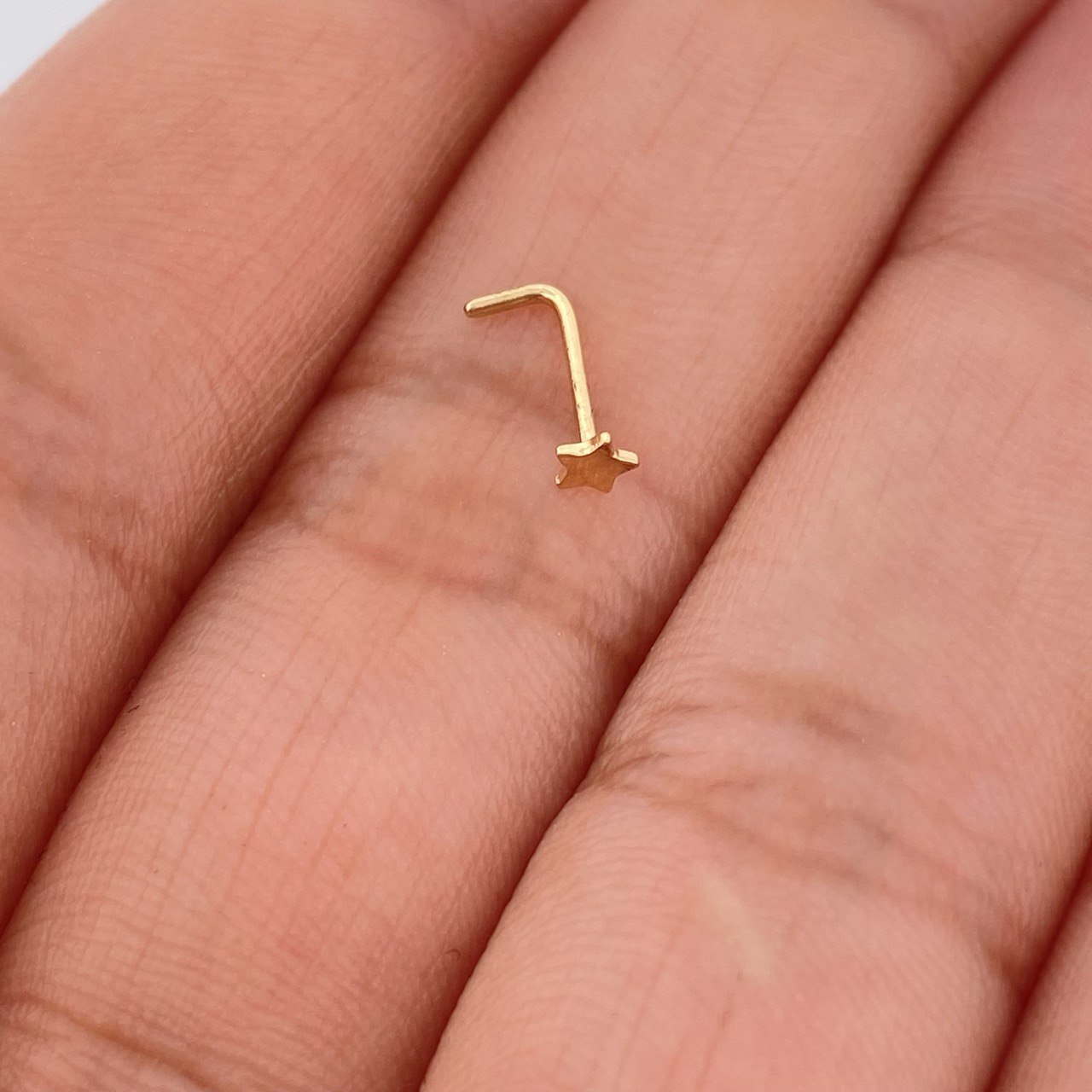 Piercing Chispa Estrella 0.1gr / 1/4 in / Oro Amarillo 18K $