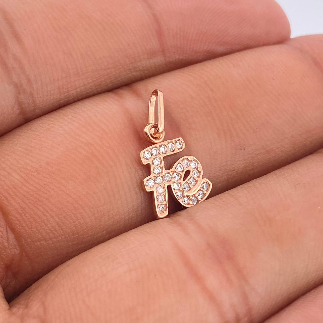 Dije Fe 0.85gr / Oro Rosa 18K %