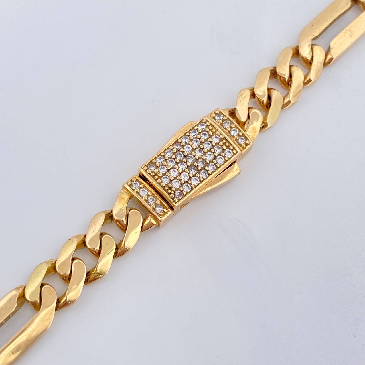 Figaro Chain 31.25gr / 24 1/4 in / 7mm 18K Yellow Gold %