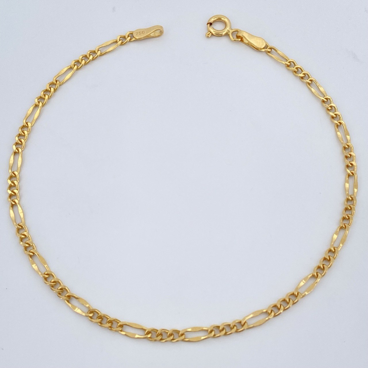 Figaro Bracelet 1.3gr / 7 1/2 in / 2.85mm 18K Gold +1 +