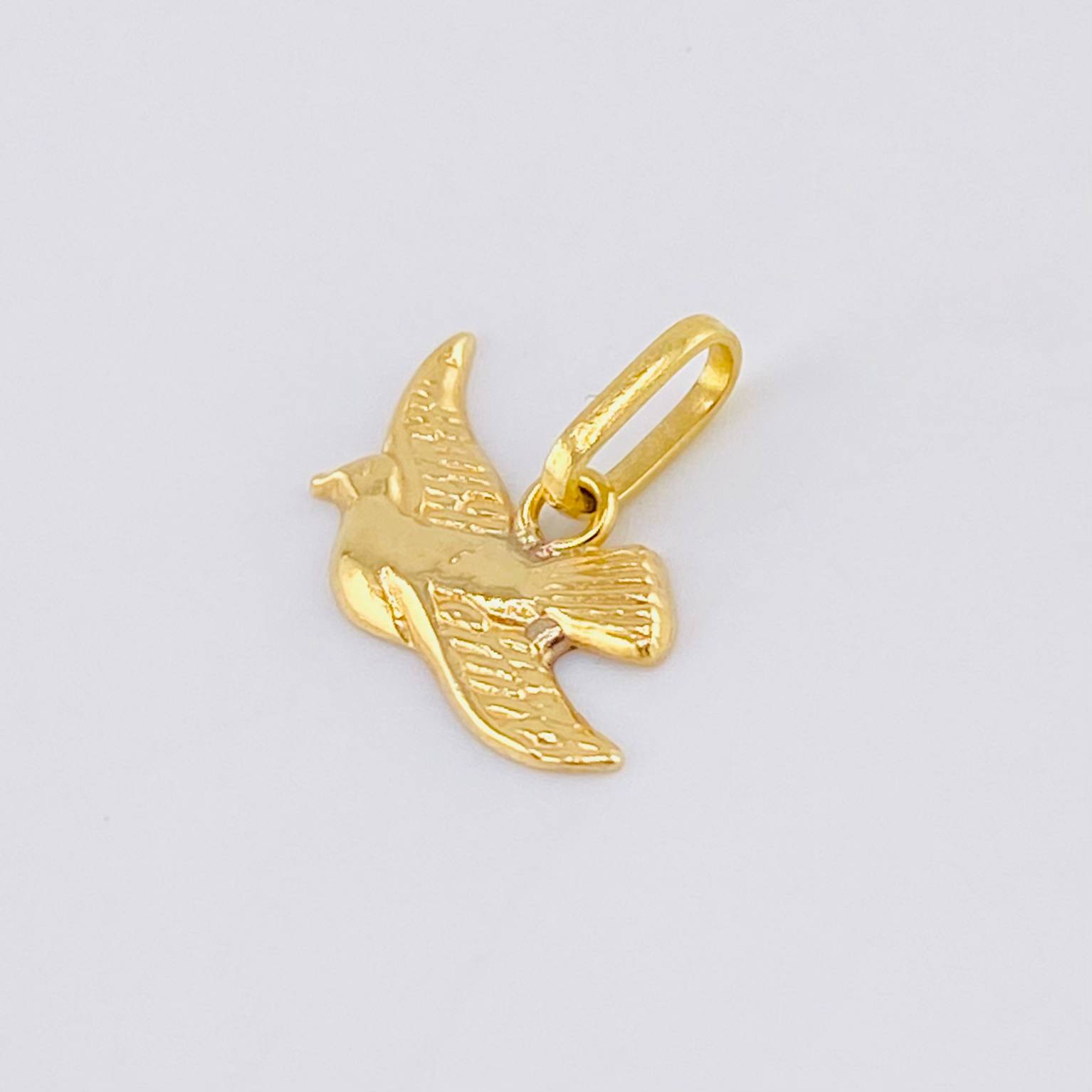 Dije Paloma 0.6gr / 1.3cm / Oro Amarillo 18K