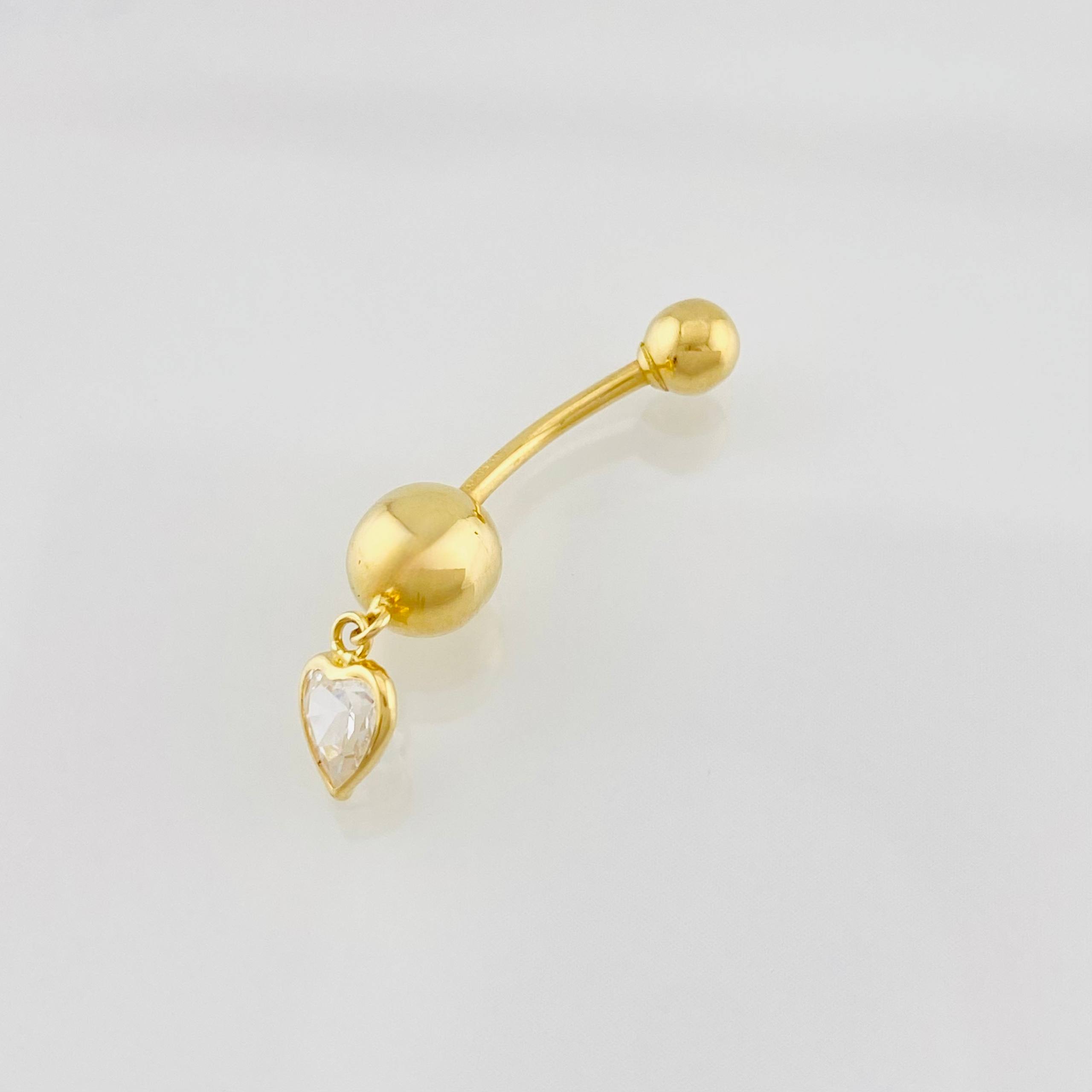 Piercing Curvo Corazon 0.75g / 1 in Oro Amarillo 18K