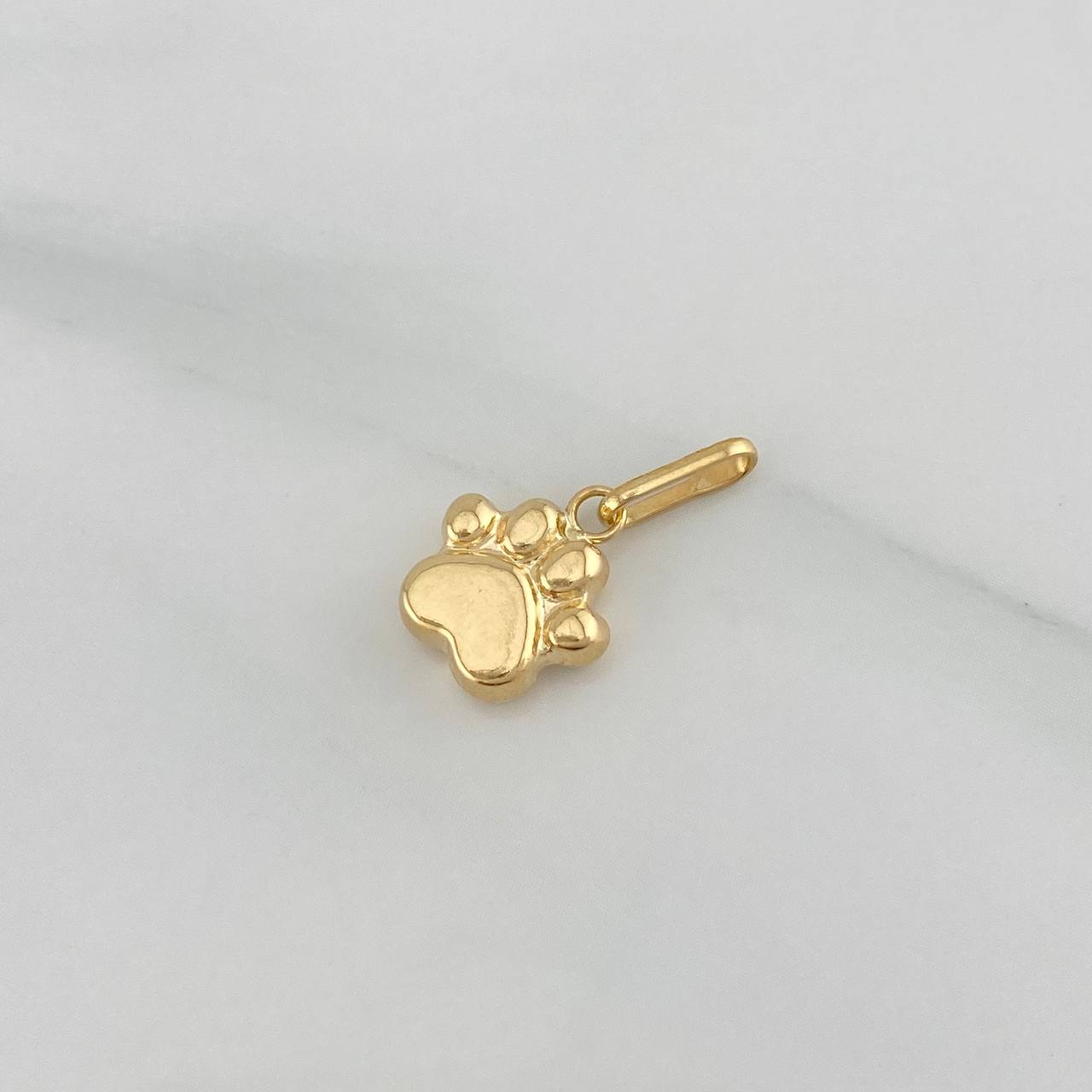 Dije Huella 0.65 g / 3/4 in Oro Amarillo 18K