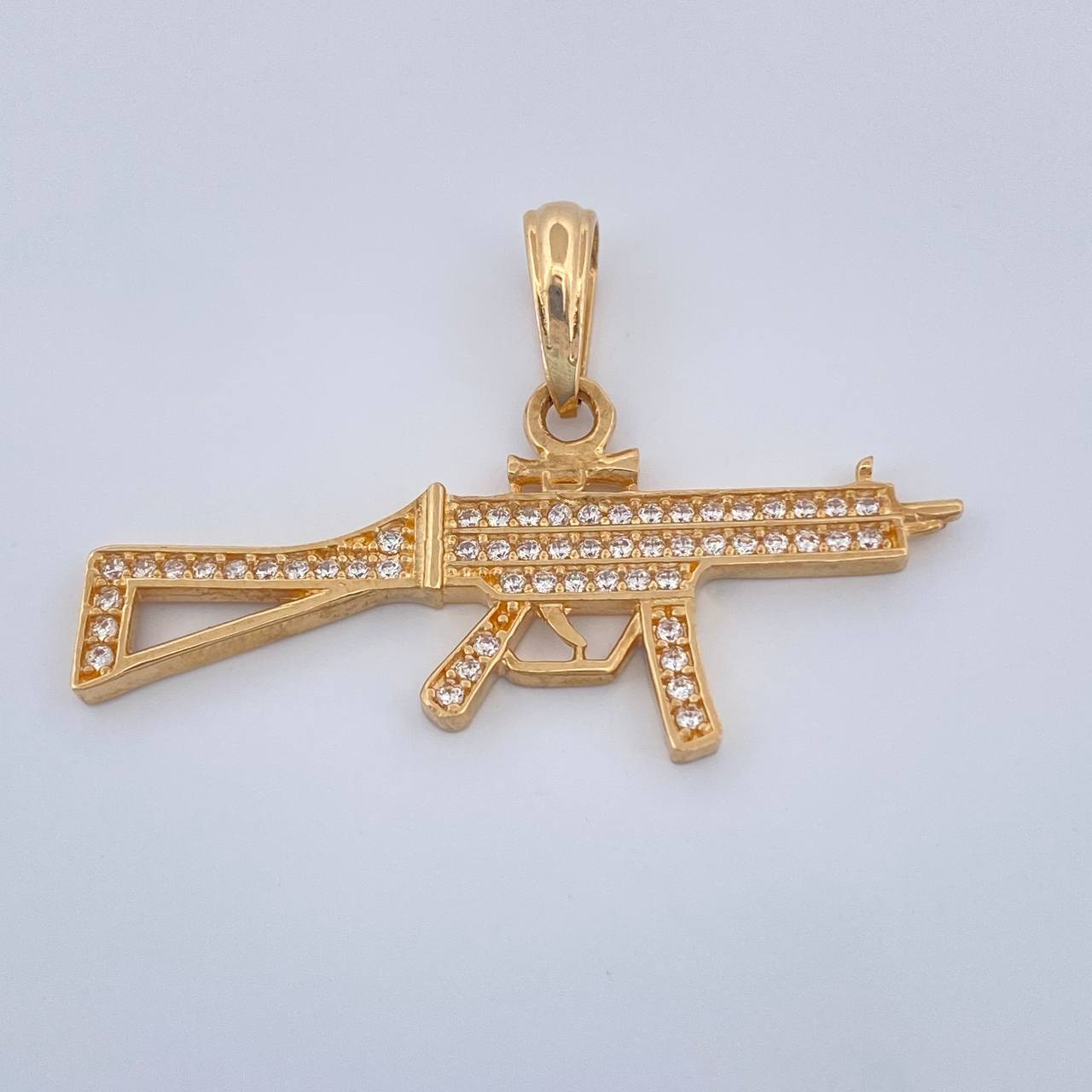 Dije Arma 2.5gr / 1 in / Oro Amarillo 18K $