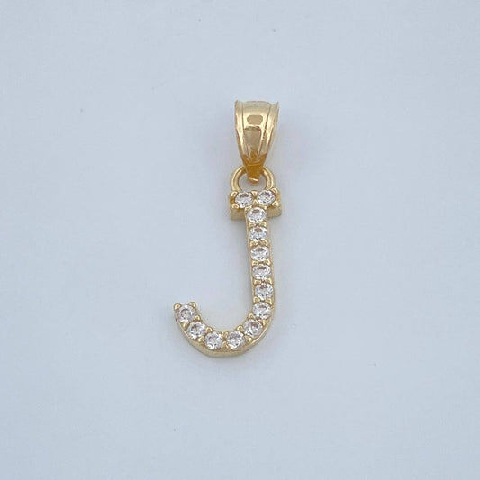Dije J 0.6gr / 3/4 in / Oro Amarillo 18K $