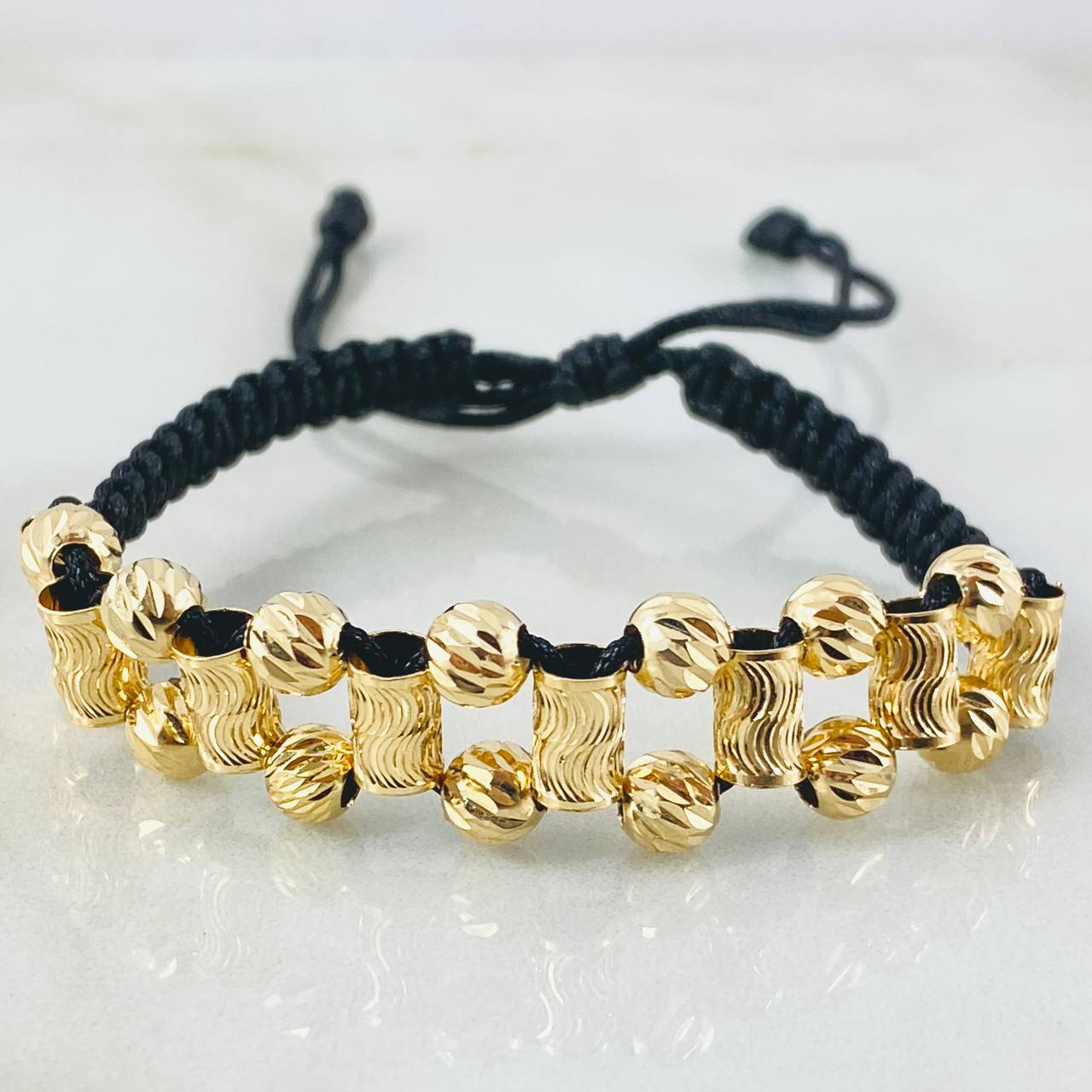 Pulsera Negra Bolas Cilindros Ola 3.1gr / 5mm Oro Amarillo 18K *