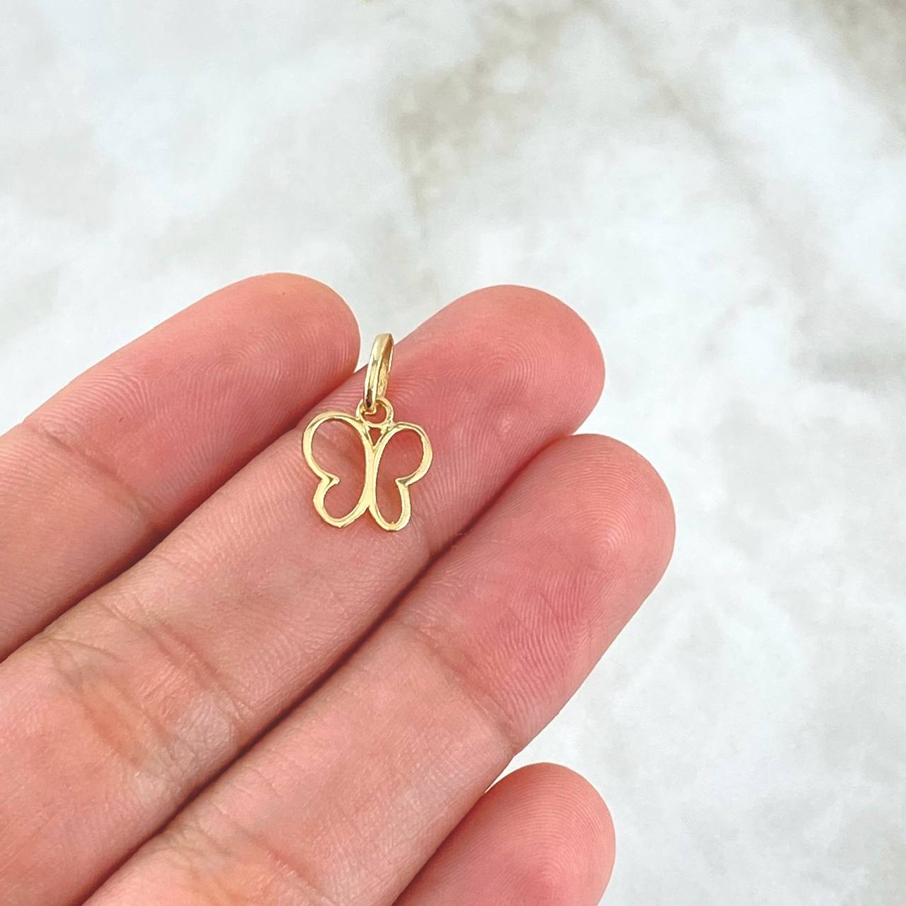 Dije Mariposa  0.4gr / 1.4cm / Silueta Lisa Oro Amarillo 18K