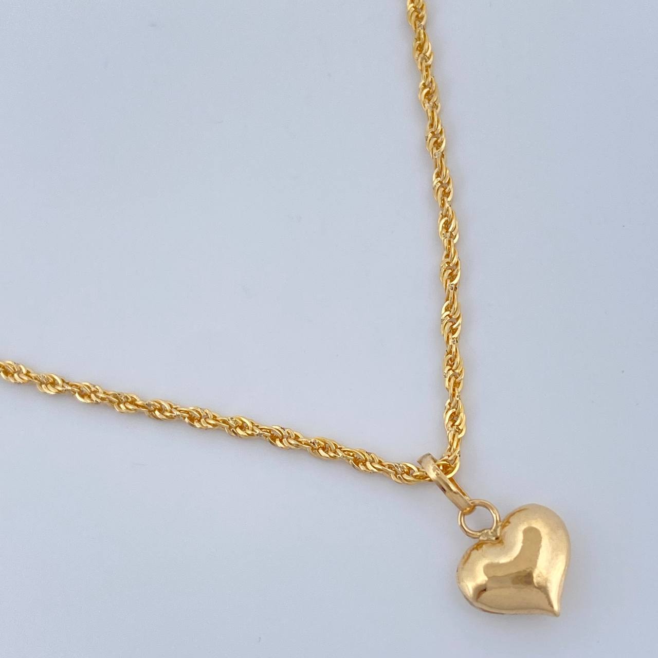 Set Cadena y Dije Lazo + Corazon 1.35gr / 15 3/4 in / Oro Amarillo 18K $