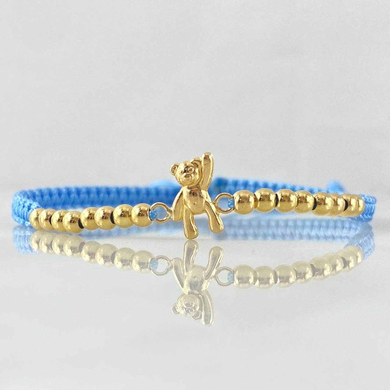 Pulsera Azul Herraje Oso Manito Arriba 1.15gr / 3mm Bolas Lisas 16und Oro Amarillo 18K *