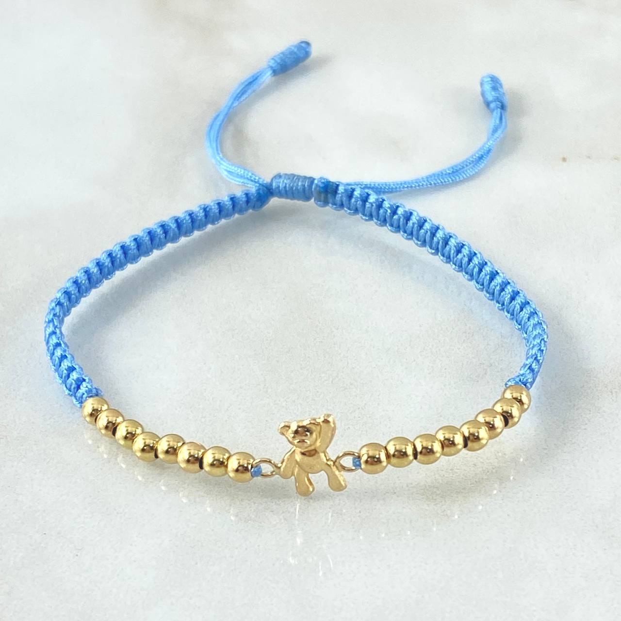 Pulsera Azul Herraje Oso Manito Arriba 1.15gr / 3mm Bolas Lisas 16und Oro Amarillo 18K *
