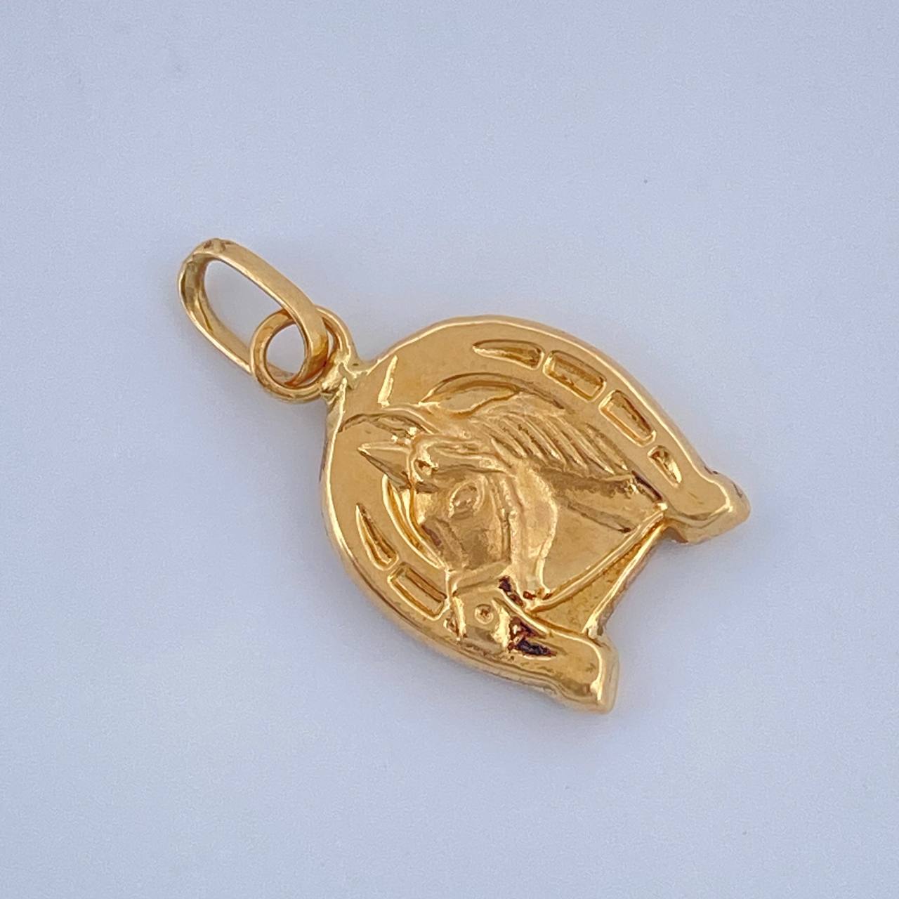 Dije Herradura Caballo 0.65gr / 3/4 in / Oro Amarillo 18K $