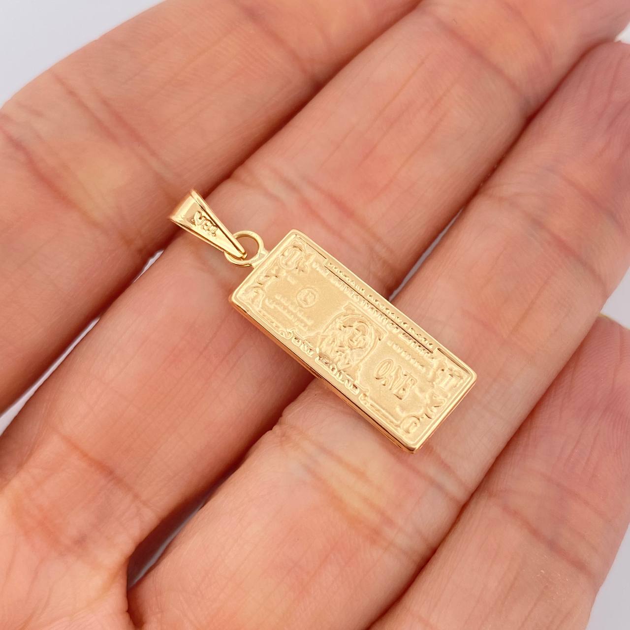 Dije One Dólar 1.4gr / 1 1/4 in / Oro Amarillo 18K $