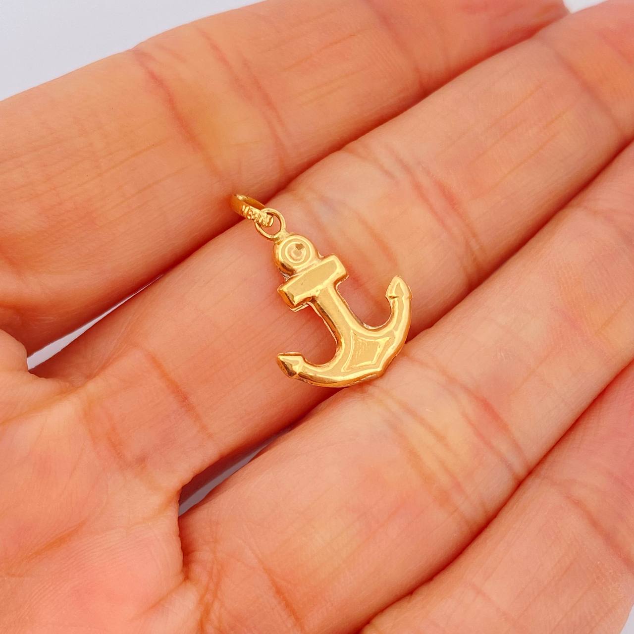 Dije Ancla 0.7gr / 1 in / Oro Amarillo 18K $