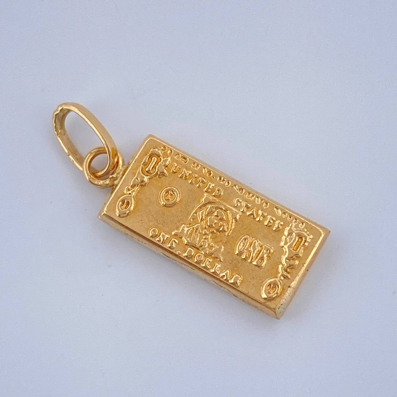 Dije One Dólar 0.55gr / 3/4 in / Oro Amarillo 18K $