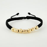 Black Woven Bracelet with Alternating Cylinders and Diamond Cut Beads in 18K Yellow Gold